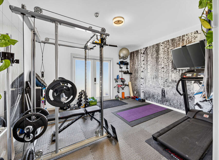 Transform your home into a personal fitness sanctuary with this fully equipped gym.