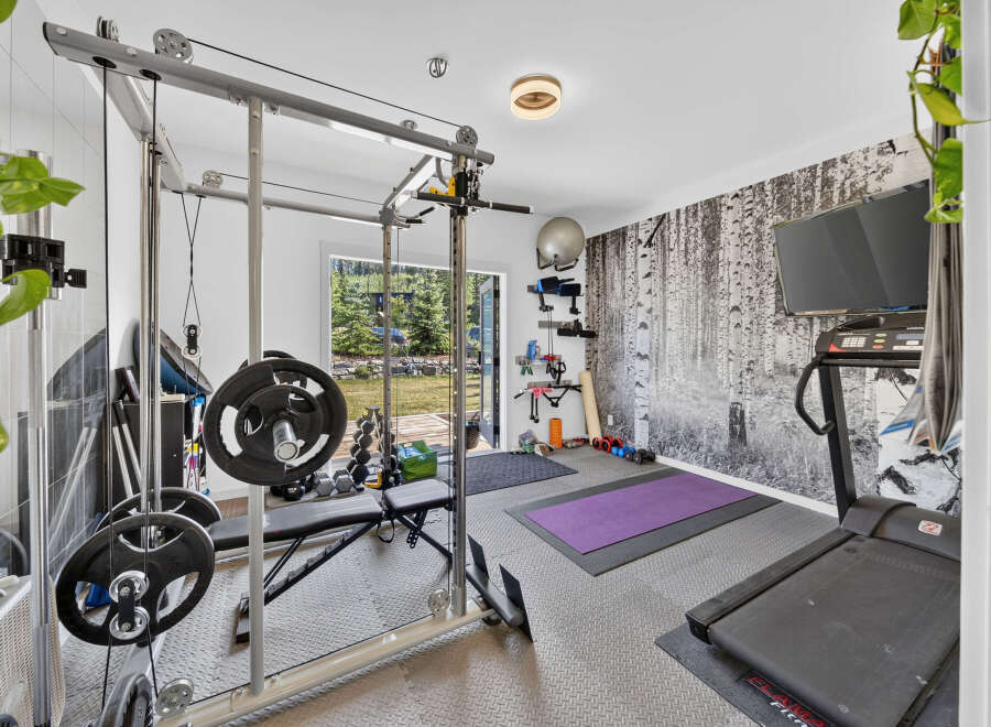 Transform your home into a personal fitness sanctuary with this fully equipped gym.