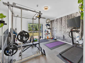 Transform your home into a personal fitness sanctuary with this fully equipped gym.