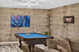 Experience ultimate relaxation in this stylish game room, featuring a professional billiard table perfect for friendly matches.