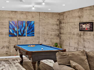 Experience ultimate relaxation in this stylish game room, featuring a professional billiard table perfect for friendly matches.