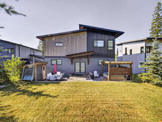 Experience modern living in this stunning home featuring a spacious backyard deck perfect for entertaining.