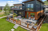Experience modern living in this stunning multi-level home featuring a sleek black and wood exterior.