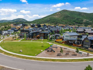 Discover modern living in this stunning hillside community, featuring contemporary homes with sleek architectural designs and expansive windows that capture breathtaking mountain views.