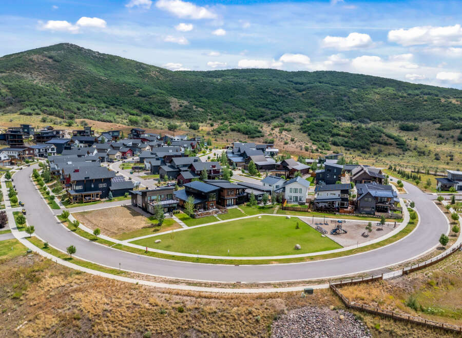 Discover modern living nestled against a scenic mountain backdrop in this stunning new development.