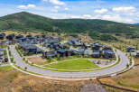 Discover modern living nestled against a scenic mountain backdrop in this stunning new development.