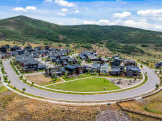 Discover modern living nestled against a scenic mountain backdrop in this stunning new development.