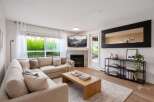 Experience modern living in this beautifully appointed living room, featuring a comfortable sectional sofa perfect for relaxation and entertaining.