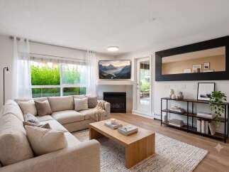 Experience modern living in this beautifully appointed living room, featuring a comfortable sectional sofa perfect for relaxation and entertaining.