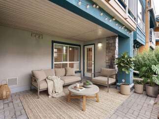 Enjoy outdoor living on this charming covered patio, perfect for relaxing or entertaining.