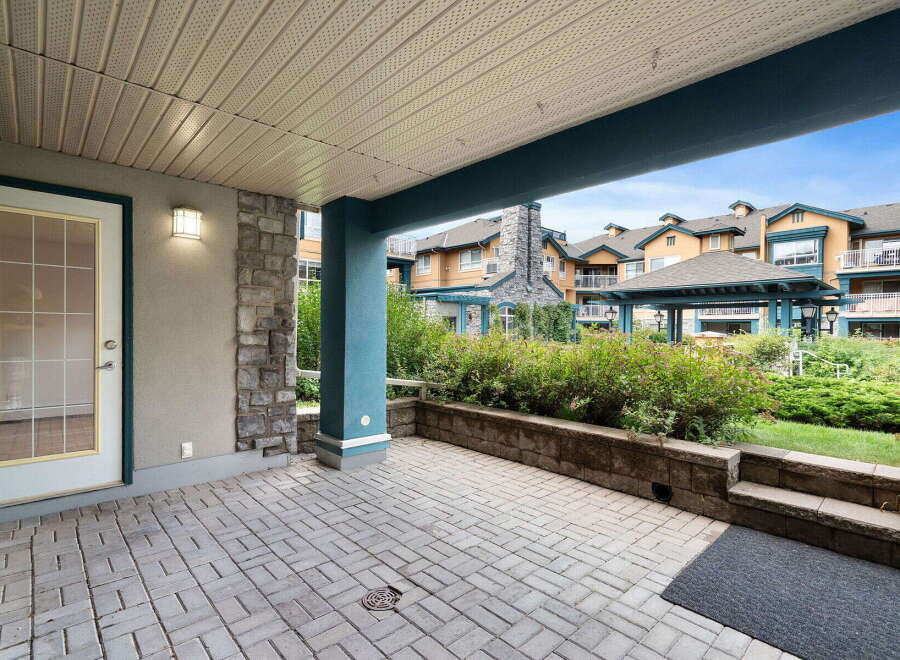 Enjoy your morning coffee on this spacious patio, perfect for outdoor relaxation and entertaining.