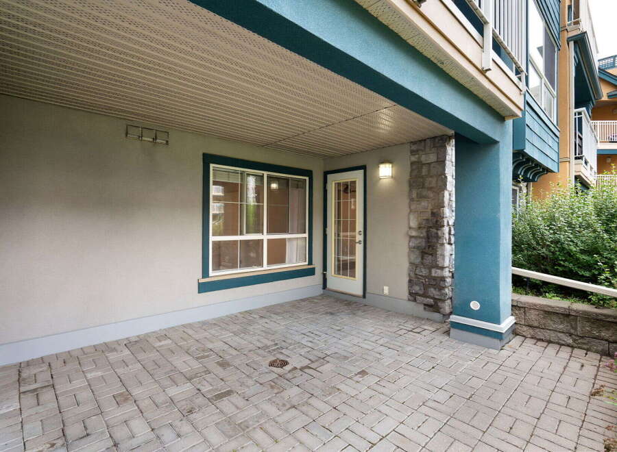 Enjoy outdoor living on this spacious patio, perfect for relaxing or entertaining.