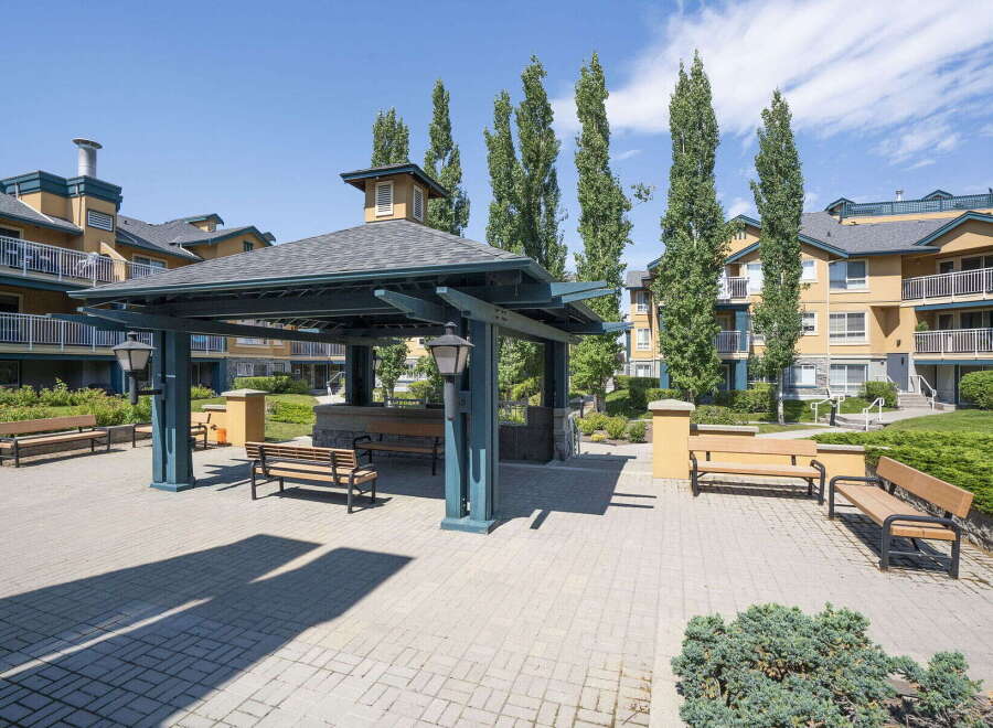 Enjoy outdoor living in this charming community space featuring a covered gazebo perfect for gatherings and relaxation.