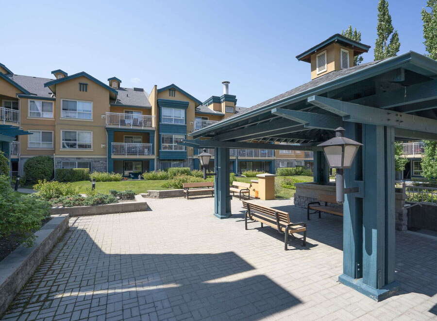 Enjoy outdoor living in this charming community featuring a covered pavilion with seating and ample green space.