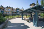 Enjoy outdoor living in this charming community featuring a covered pavilion with seating and ample green space.