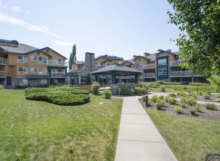 Discover comfortable living in this well-maintained apartment complex featuring a charming gazebo and lush green spaces.