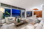 Experience luxurious modern living in this stunning open-concept space, featuring a gourmet kitchen with a large island and ample custom cabinetry.