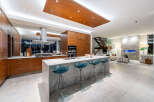 Experience luxury living in this modern open-concept kitchen and living space.