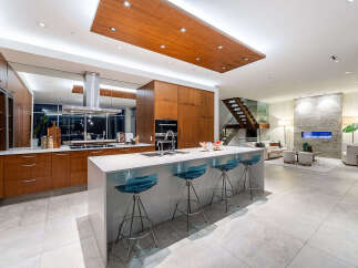 Experience luxury living in this modern open-concept kitchen and living space.