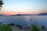 Experience breathtaking sunset views over the water from this stunning property.