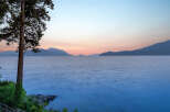 Experience breathtaking sunset views over the tranquil water from this stunning property.