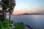 Experience breathtaking sunset views over the water from this stunning property.