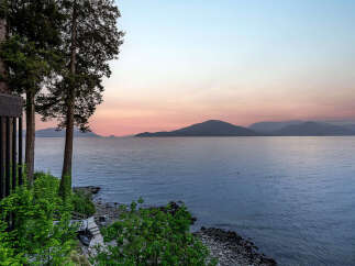 Experience breathtaking sunset views over the water from this stunning property.