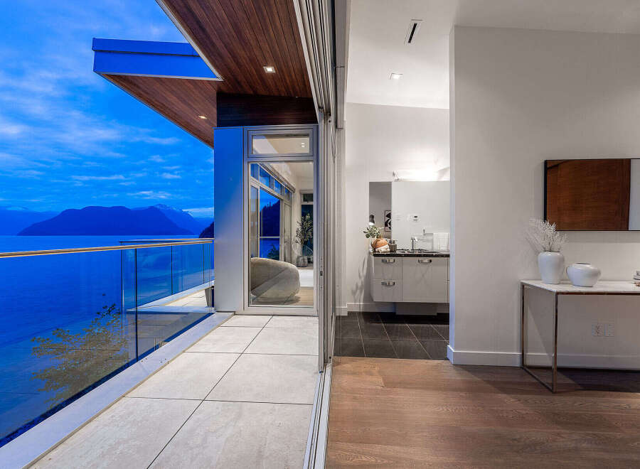 Experience luxury living with breathtaking ocean and mountain views from this stunning modern residence.