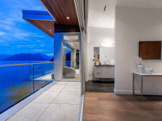 Experience luxury living with breathtaking ocean and mountain views from this stunning modern residence.