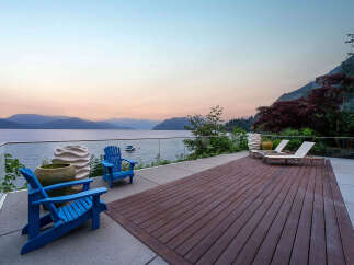 Experience breathtaking waterfront living with this stunning property, featuring a spacious deck perfect for entertaining and relaxation.