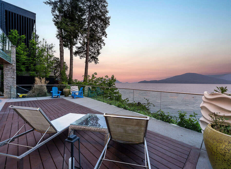 Experience breathtaking sunset views from this modern waterfront property.