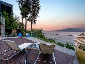 Experience breathtaking sunset views from this modern waterfront property.