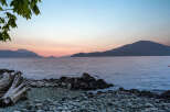Experience breathtaking sunset views over the water from this stunning coastal property.