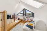 Discover this charming attic space, perfect for a cozy retreat or a creative studio.