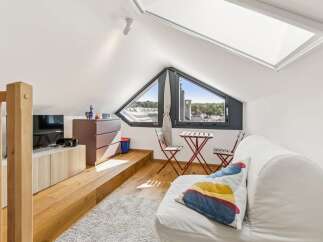 Discover this charming attic space, perfect for a cozy retreat or a creative studio.