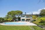 Experience luxurious outdoor living with this stunning property featuring a sparkling swimming pool and a dedicated children's play area.