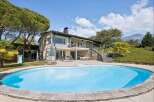 Enjoy a luxurious lifestyle with this stunning property featuring a large, sparkling swimming pool perfect for relaxation and entertainment.