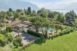 Discover this stunning property offering breathtaking panoramic views of the lake and majestic mountains.