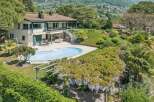 Discover this stunning property featuring a beautiful swimming pool and lush gardens, perfect for relaxation and entertaining.