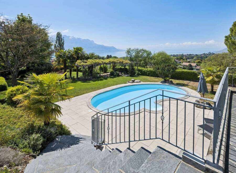 Experience luxurious outdoor living with this stunning property featuring a private swimming pool and expansive patio area, perfect for relaxation and entertainment.