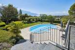 Experience luxurious outdoor living with this stunning property featuring a private swimming pool and expansive patio area, perfect for relaxation and entertainment.