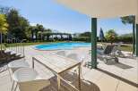 Enjoy ultimate relaxation by this stunning kidney-shaped swimming pool, perfect for a refreshing dip on a sunny day.