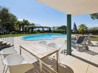 Enjoy ultimate relaxation by this stunning kidney-shaped swimming pool, perfect for a refreshing dip on a sunny day.