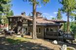 Experience mountain living in this stunning property featuring a spacious deck perfect for entertaining and a relaxing hot tub.
