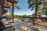 Enjoy breathtaking mountain views from this expansive wooden deck, perfect for outdoor entertaining.