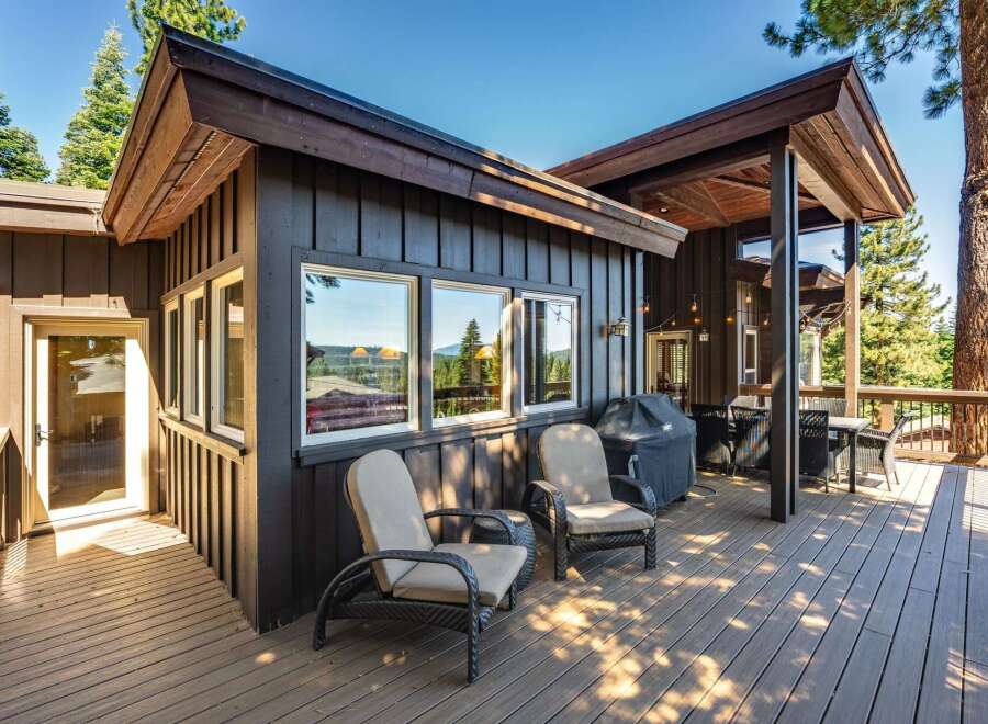 Enjoy outdoor living on this spacious deck, perfect for entertaining or relaxing amidst the scenic views.