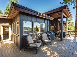 Enjoy outdoor living on this spacious deck, perfect for entertaining or relaxing amidst the scenic views.