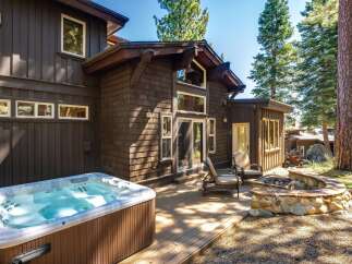 Experience ultimate relaxation in this stunning mountain retreat, featuring a luxurious hot tub perfect for unwinding after a day of adventure.