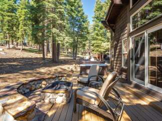 Enjoy the ultimate outdoor living experience with this stunning property featuring a luxurious hot tub and a charming stone fire pit.