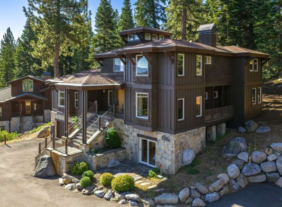 Experience luxury mountain living in this stunning custom-built home nestled among tall pines.